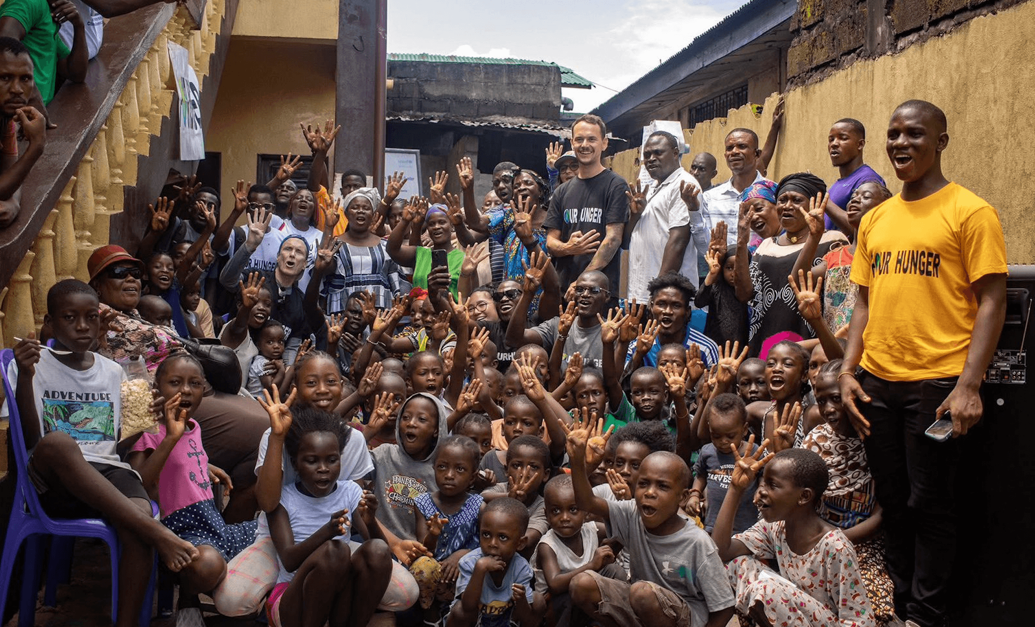 Four Hunger team and community at a partner home.